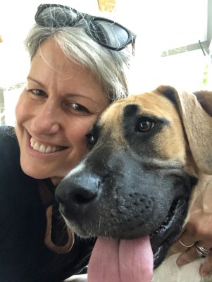 Image of Kim Price-Glynn and her dog, a great dane mix named Daisy.